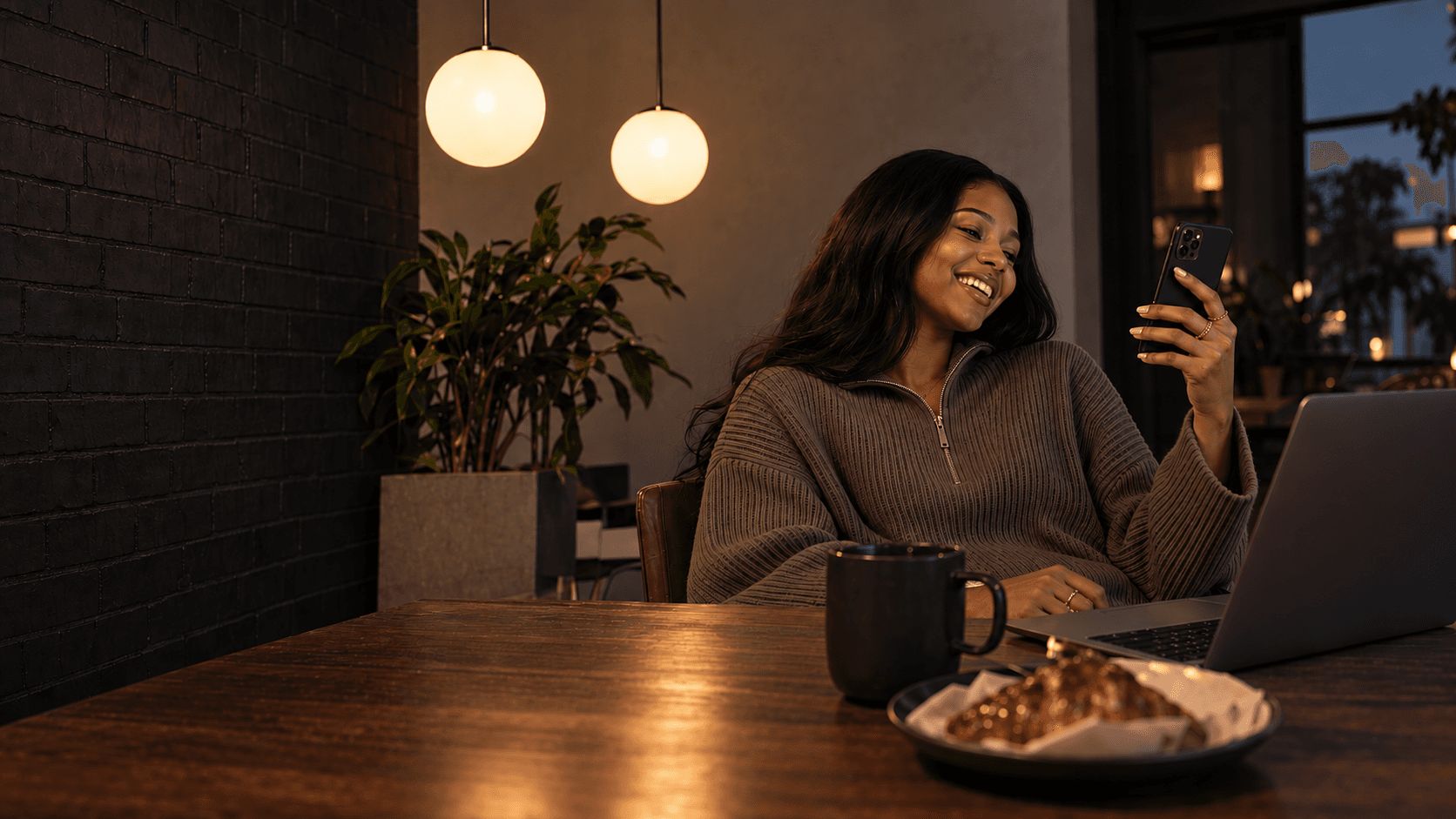 Getly user smiling while using her smartphone at a café table